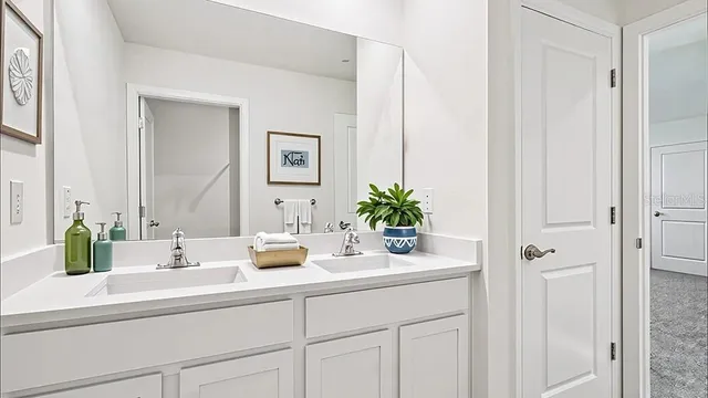 a bathroom with cabinets and sink