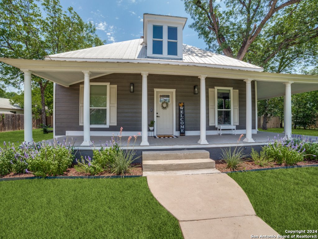 1106 North High Street Uvalde, TX 78801 - Photo 1 of 1 a view of a house with a yard and plants