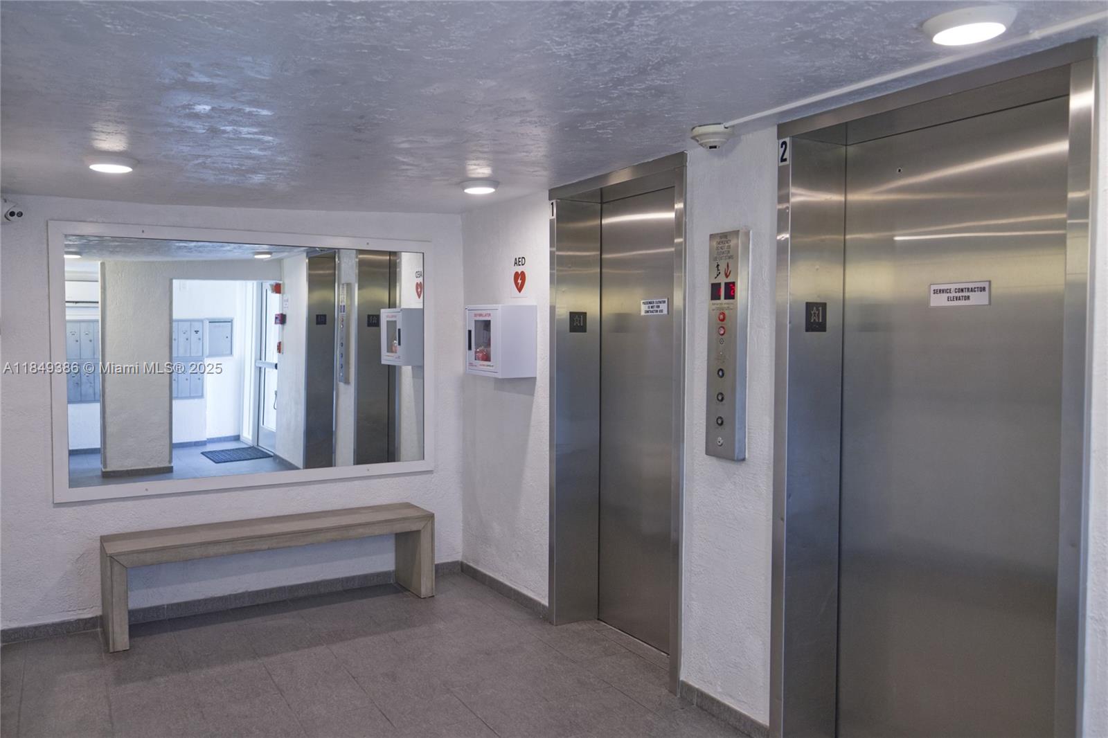 400 North Surf Road, Unit 1002 Hollywood, FL 33019 - Photo 26 of 33 a bathroom with a mirror and a shower