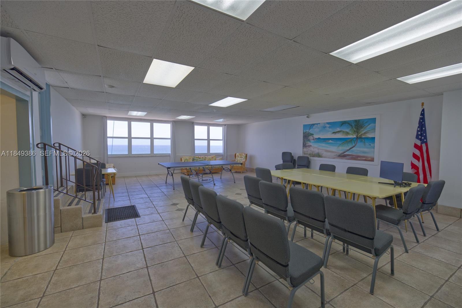 400 North Surf Road, Unit 1002 Hollywood, FL 33019 - Photo 42 of 43 a living room with furniture and a dining table with wooden floor