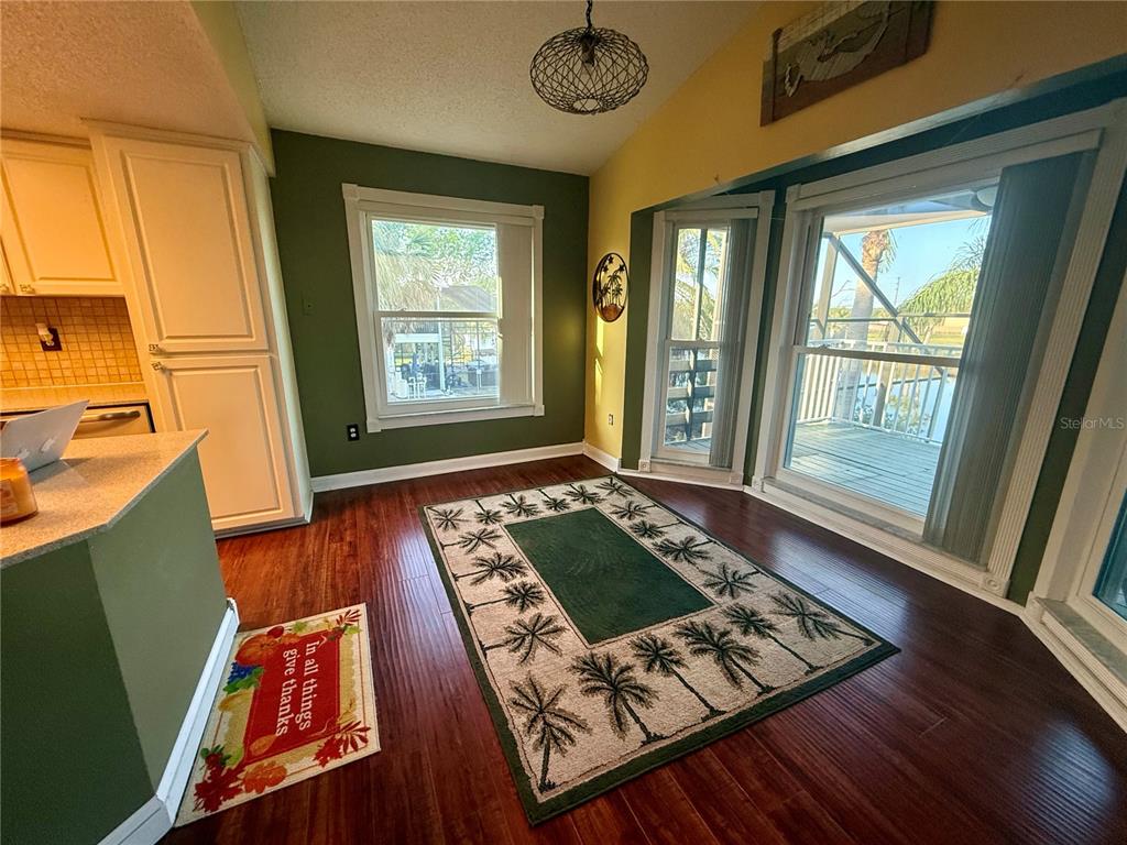 3338 Fernleaf Drive Hernando Beach, FL 34607 - Photo 11 of 69 a living room with furniture rug and a large window
