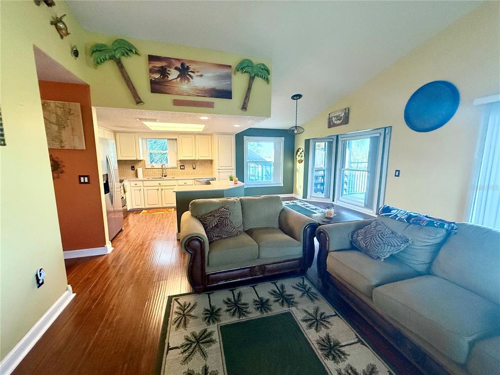 3338 Fernleaf Drive Hernando Beach, FL 34607 - Photo 13 of 69 a living room with furniture and a wooden floor
