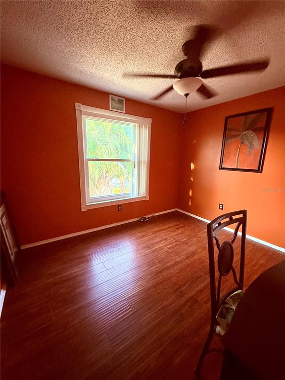 3338 Fernleaf Drive Hernando Beach, FL 34607 - Photo 20 of 69 a view of room with window and wooden floor