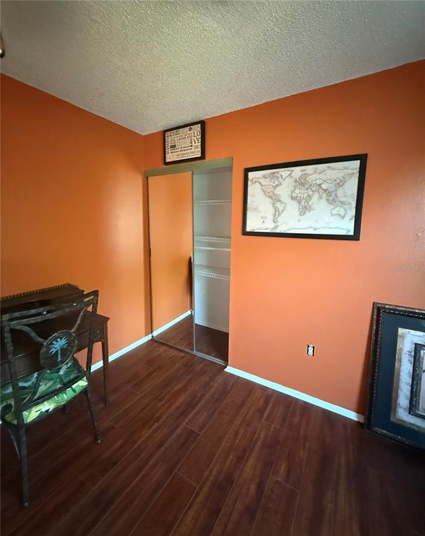 3338 Fernleaf Drive Hernando Beach, FL 34607 - Photo 21 of 69 an empty room with wooden floor and windows
