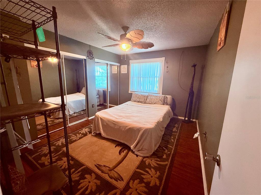 3338 Fernleaf Drive Hernando Beach, FL 34607 - Photo 22 of 69 a bed sitting in a room next to a window