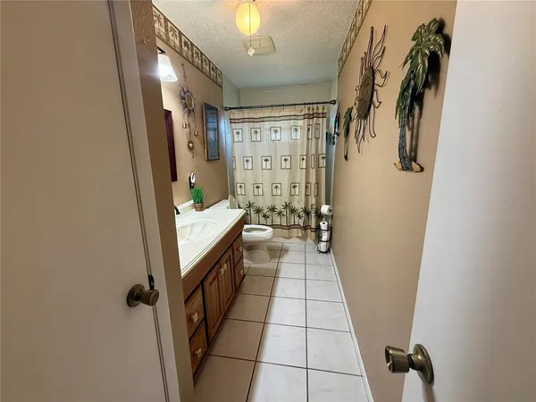 a bathroom with a sink a mirror and bathtub