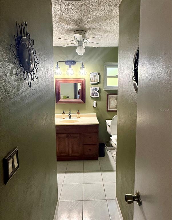 3338 Fernleaf Drive Hernando Beach, FL 34607 - Photo 29 of 69 a bathroom with a sink a mirror and bathtub