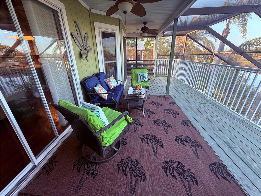 3338 Fernleaf Drive Hernando Beach, FL 34607 - Photo 40 of 69 a balcony with furniture and garden view