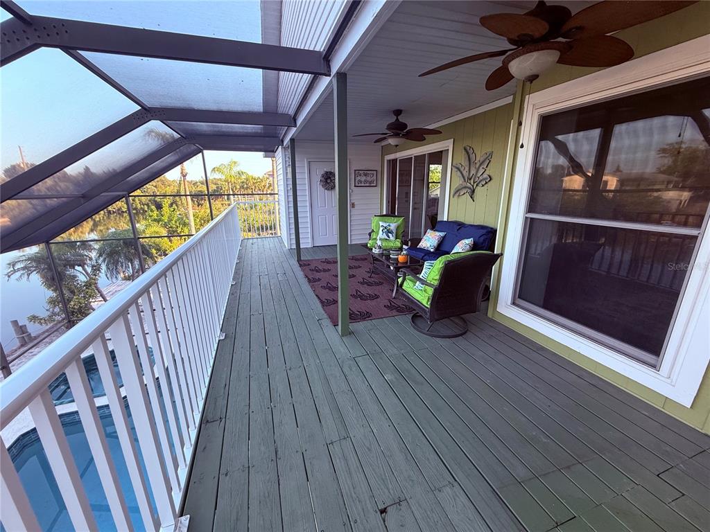 3338 Fernleaf Drive Hernando Beach, FL 34607 - Photo 41 of 69 a view of two chairs in the balcony