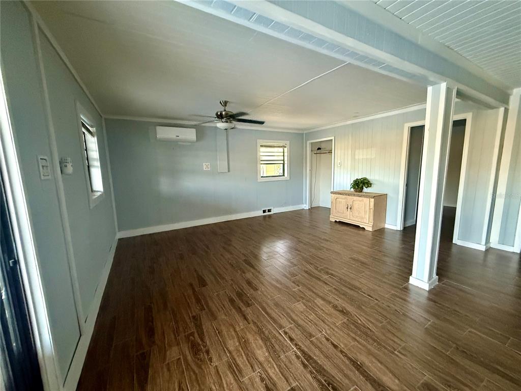 3338 Fernleaf Drive Hernando Beach, FL 34607 - Photo 52 of 69 wooden floor in an empty room with a window