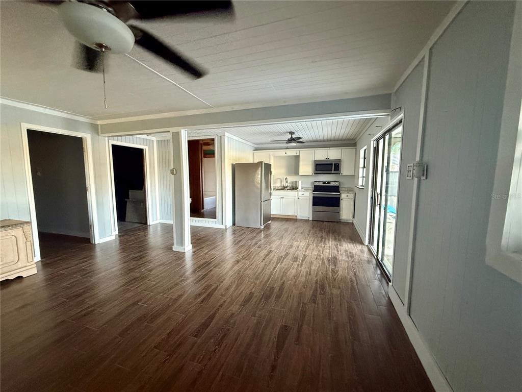 3338 Fernleaf Drive Hernando Beach, FL 34607 - Photo 53 of 69 wooden floor in an empty room with a window