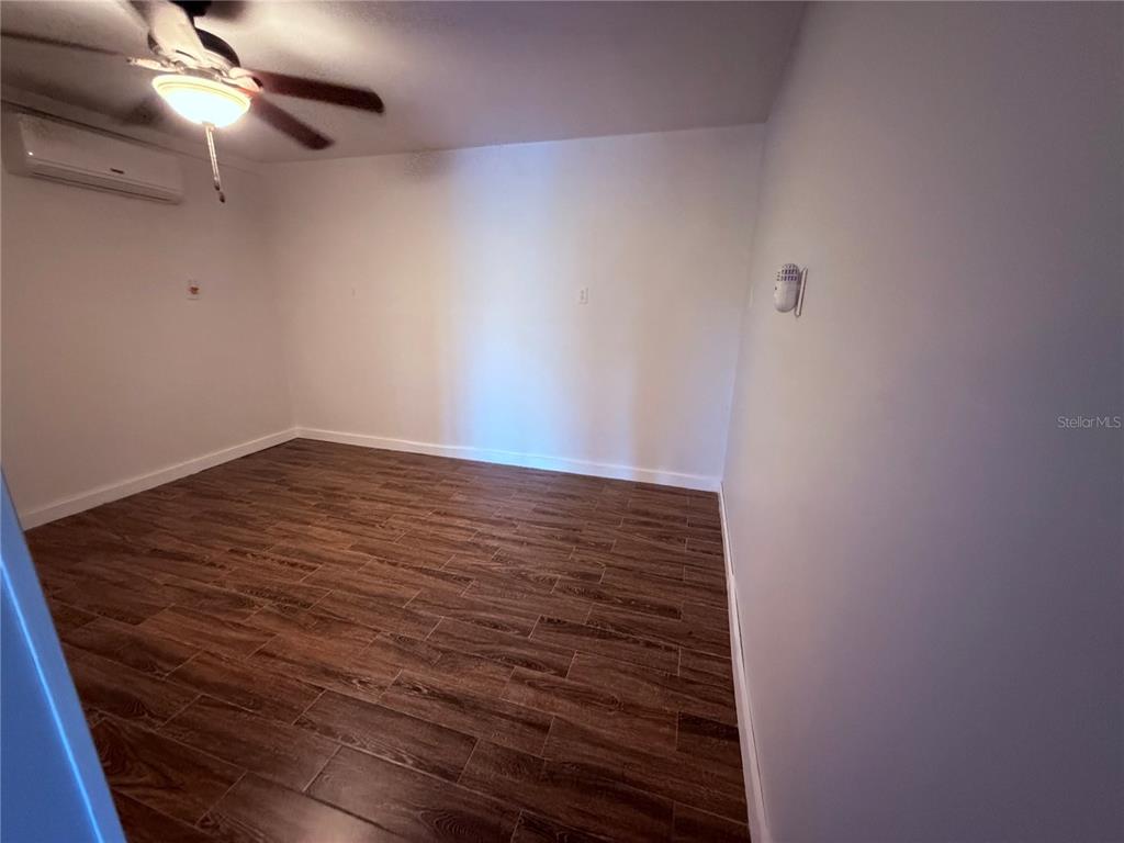 3338 Fernleaf Drive Hernando Beach, FL 34607 - Photo 57 of 69 en empty room with wooden floor