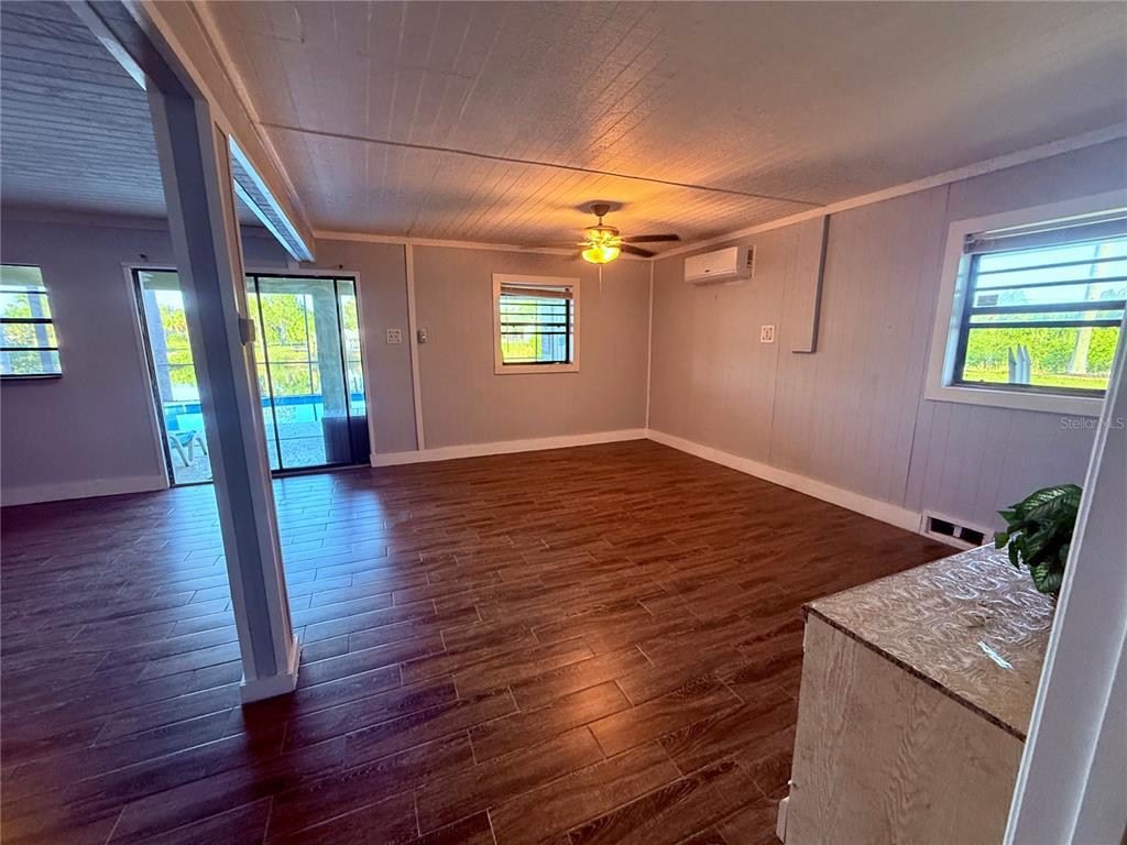 3338 Fernleaf Drive Hernando Beach, FL 34607 - Photo 59 of 69 a view of entryway with window and wooden floor