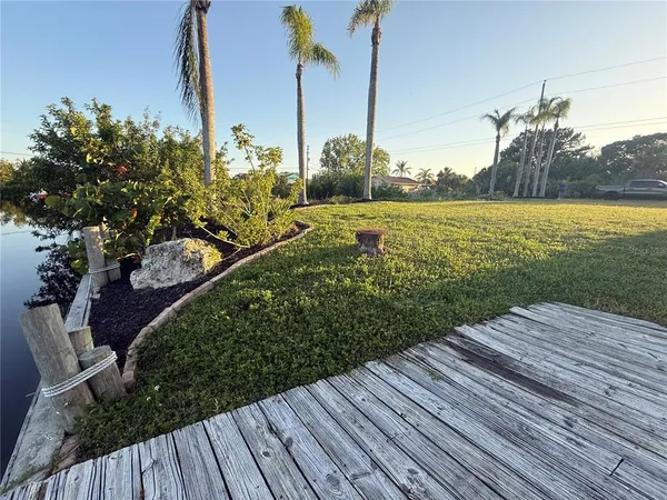 a room with painting on the wall and a fireplace