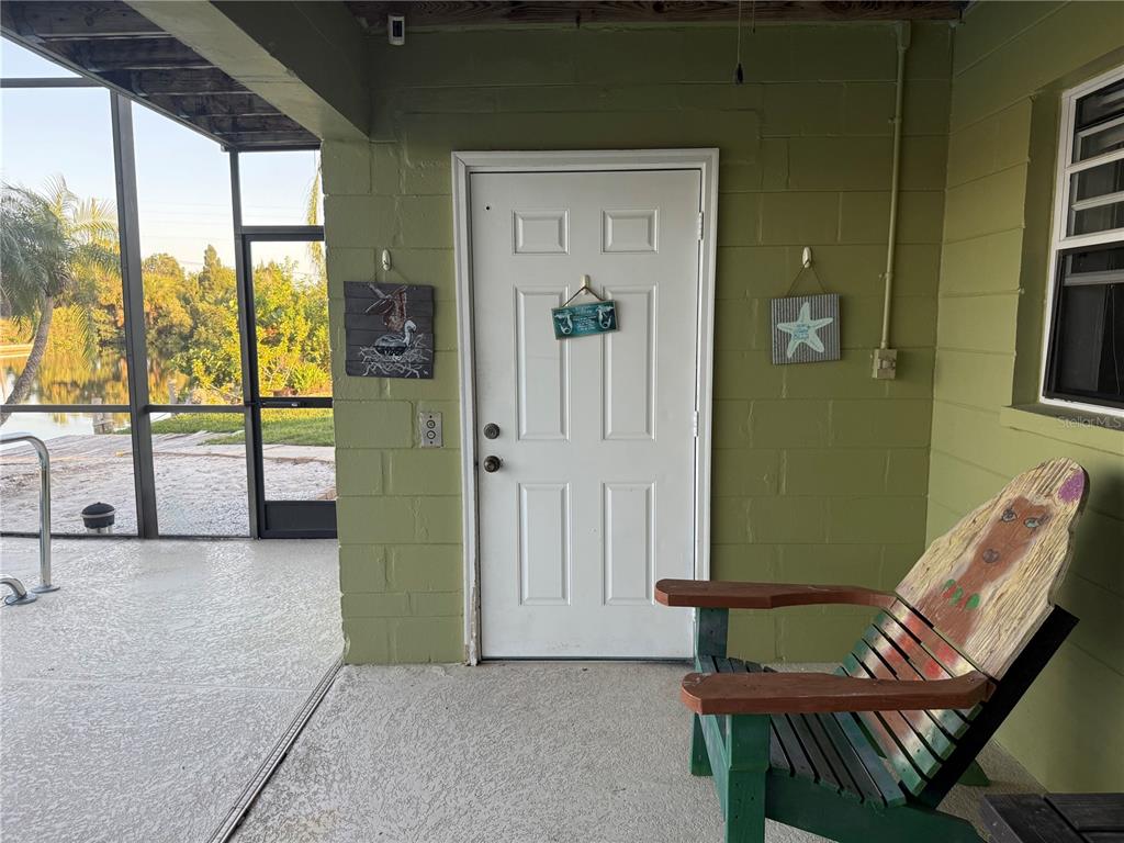 3338 Fernleaf Drive Hernando Beach, FL 34607 - Photo 63 of 69 a view of a hallway with furniture and windows