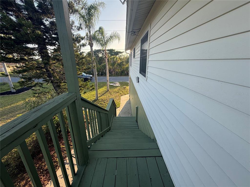 3338 Fernleaf Drive Hernando Beach, FL 34607 - Photo 64 of 69 a view of balcony with wooden floor and fence