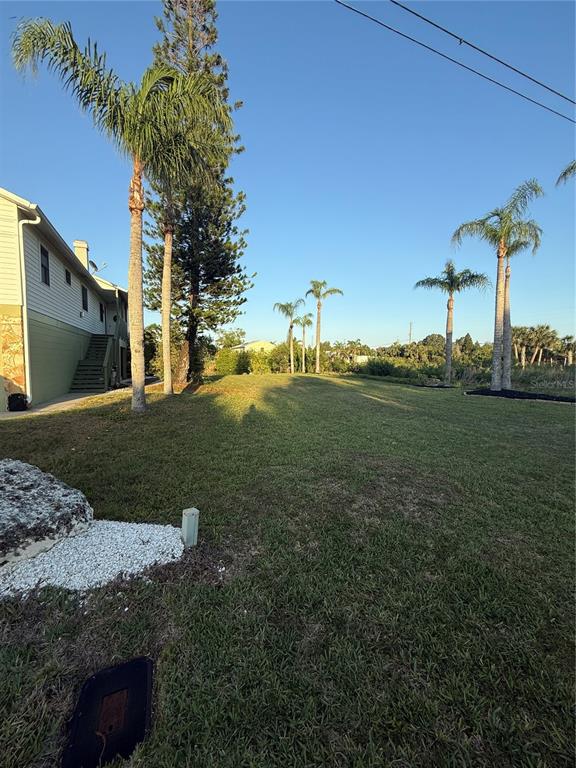 3338 Fernleaf Drive Hernando Beach, FL 34607 - Photo 66 of 69 a view of a house with a yard