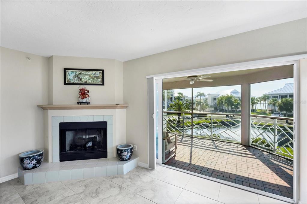 11000 Placida Road, Unit 2202 Placida, FL 33946 - Photo 11 of 58 a living room with furniture and a fireplace