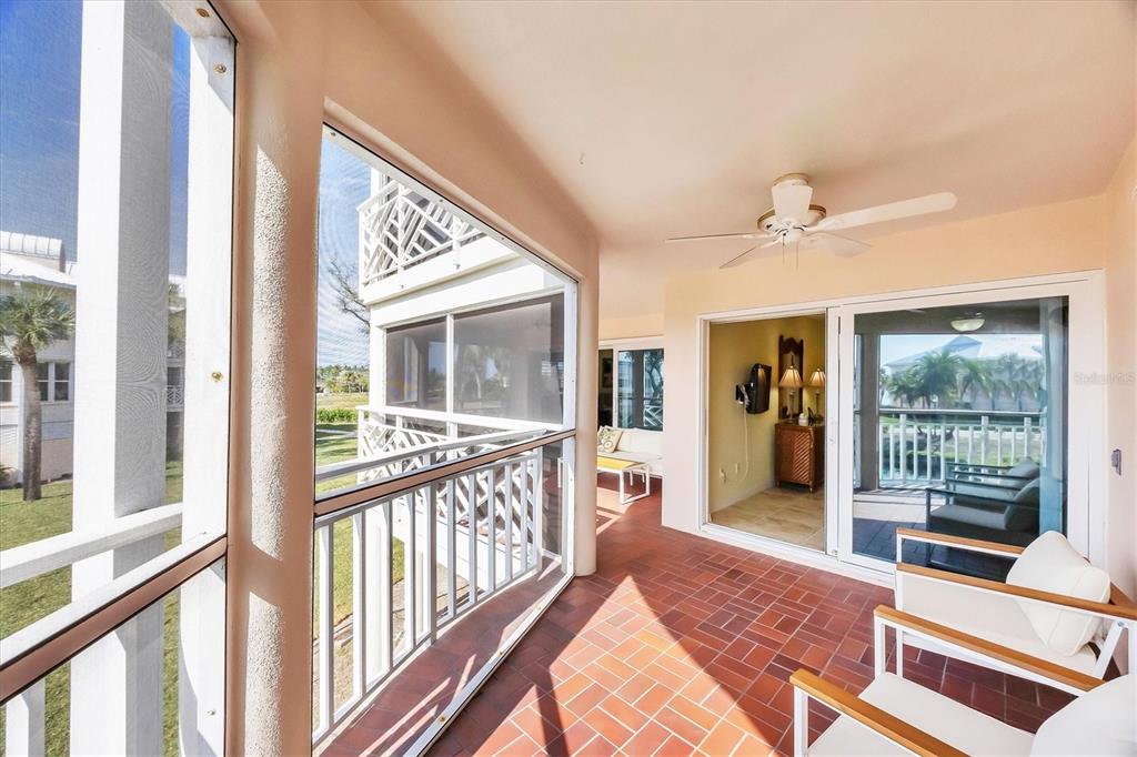 11000 Placida Road, Unit 2202 Placida, FL 33946 - Photo 14 of 58 a view of a hallway with wooden floor and windows