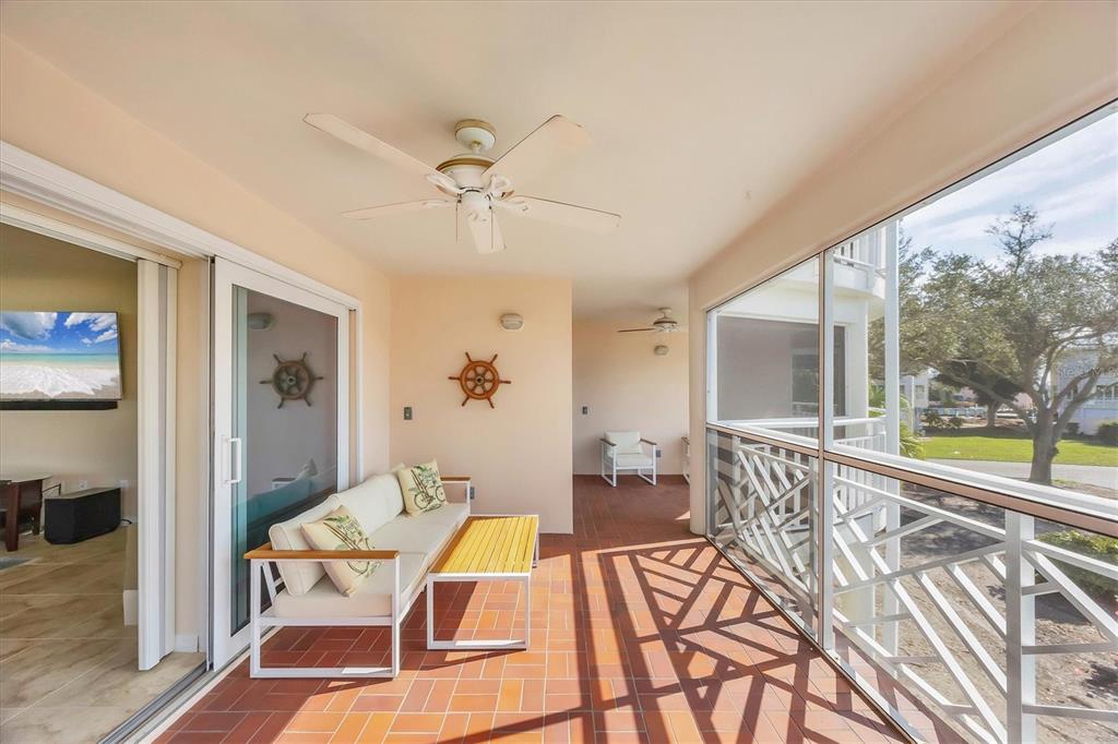 11000 Placida Road, Unit 2202 Placida, FL 33946 - Photo 15 of 58 a living room with furniture and a large window