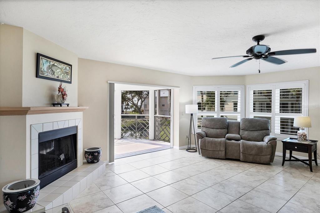 11000 Placida Road, Unit 2202 Placida, FL 33946 - Photo 17 of 58 a living room with furniture and a fireplace
