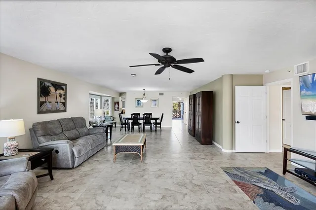 a bathroom with a double vanity sink a large mirror and shower