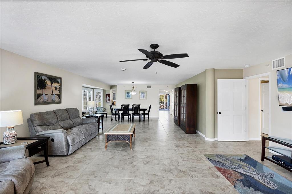 11000 Placida Road, Unit 2202 Placida, FL 33946 - Photo 18 of 58 a living room with furniture and a large window