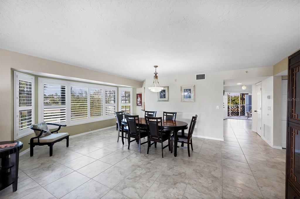 11000 Placida Road, Unit 2202 Placida, FL 33946 - Photo 19 of 58 a view of a dining room with furniture