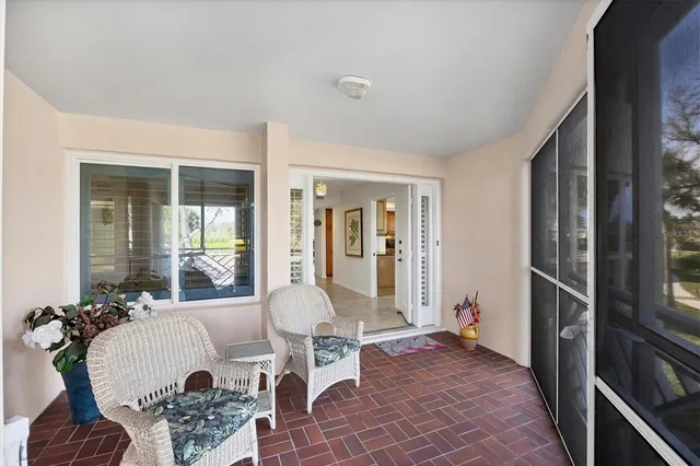 a view of a dining room with furniture and windows