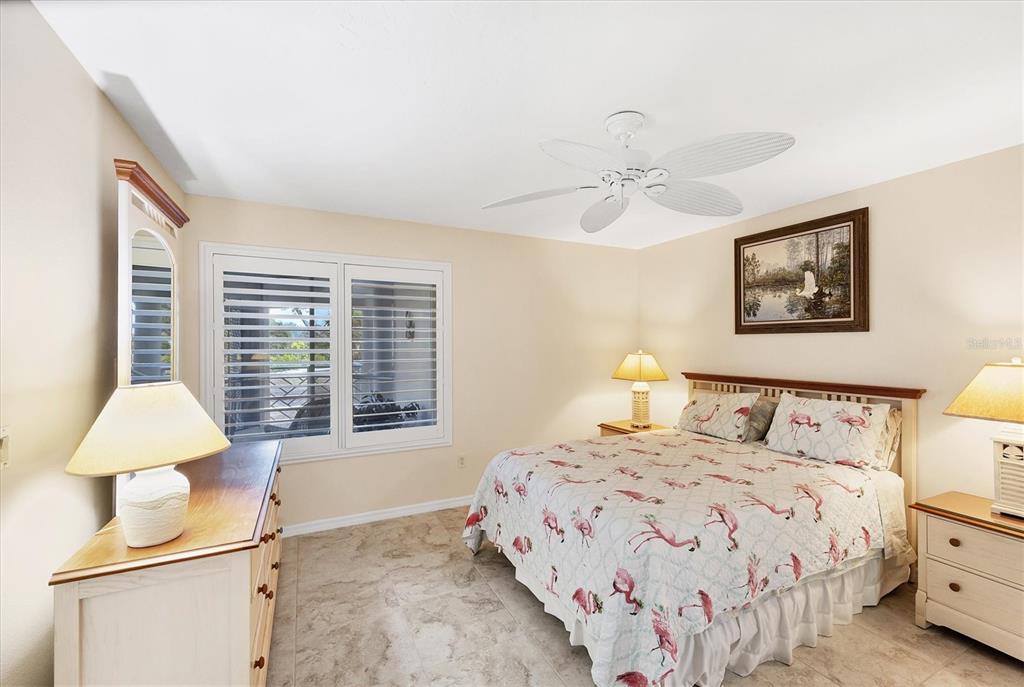 11000 Placida Road, Unit 2202 Placida, FL 33946 - Photo 24 of 58 a bedroom with a bed and a window