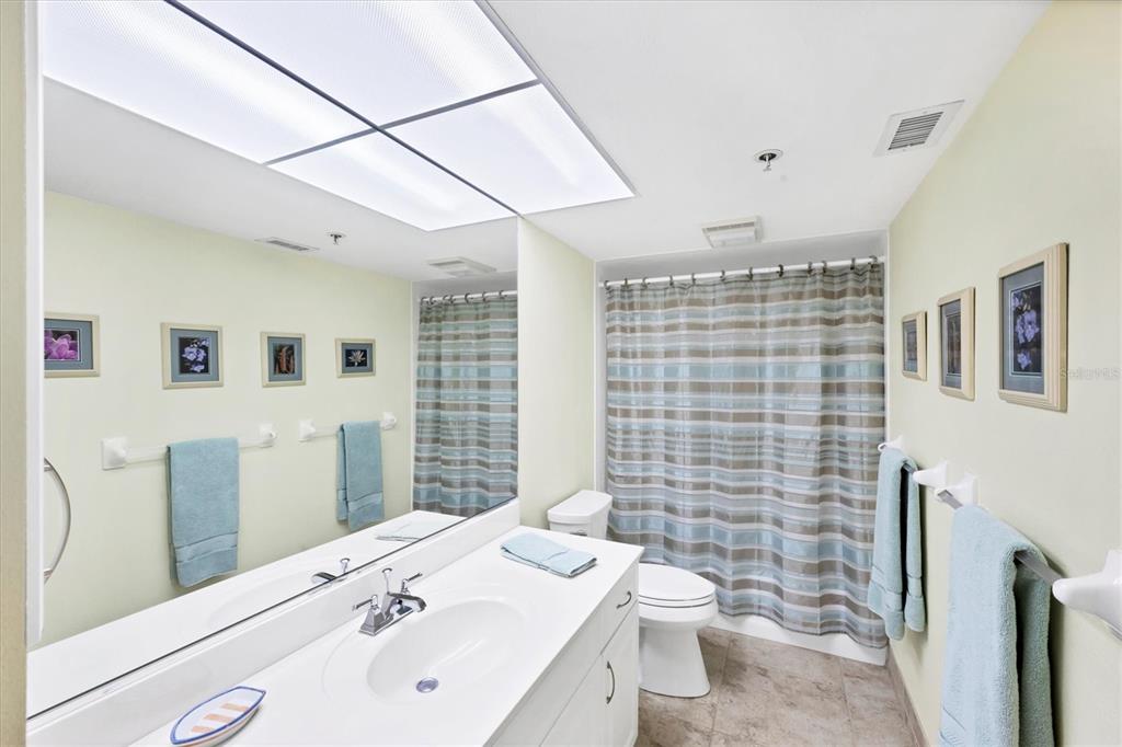 11000 Placida Road, Unit 2202 Placida, FL 33946 - Photo 25 of 58 a bathroom with a sink a toilet and shower