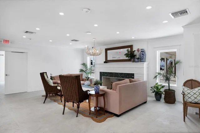 an aerial view of a house with a swimming pool outdoor seating and yard