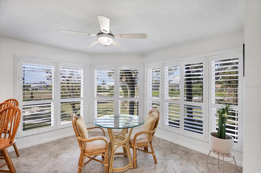 11000 Placida Road, Unit 2202 Placida, FL 33946 - Photo 4 of 58 a view of a dining room with furniture and windows