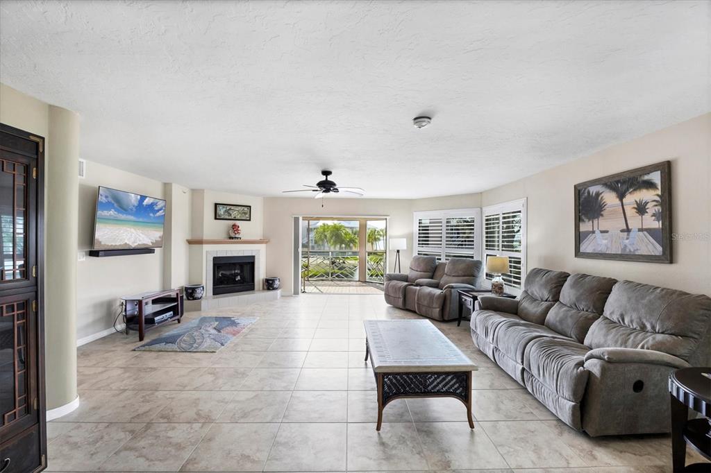 11000 Placida Road, Unit 2202 Placida, FL 33946 - Photo 10 of 58 a living room with furniture large window and flat screen tv