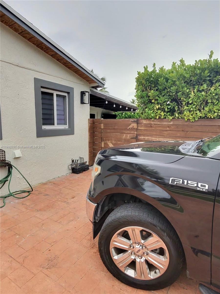 20180 Northwest 14th Court Miami Gardens, FL 33169 - Photo 4 of 12 a backyard of a house with barbeque oven and a stove