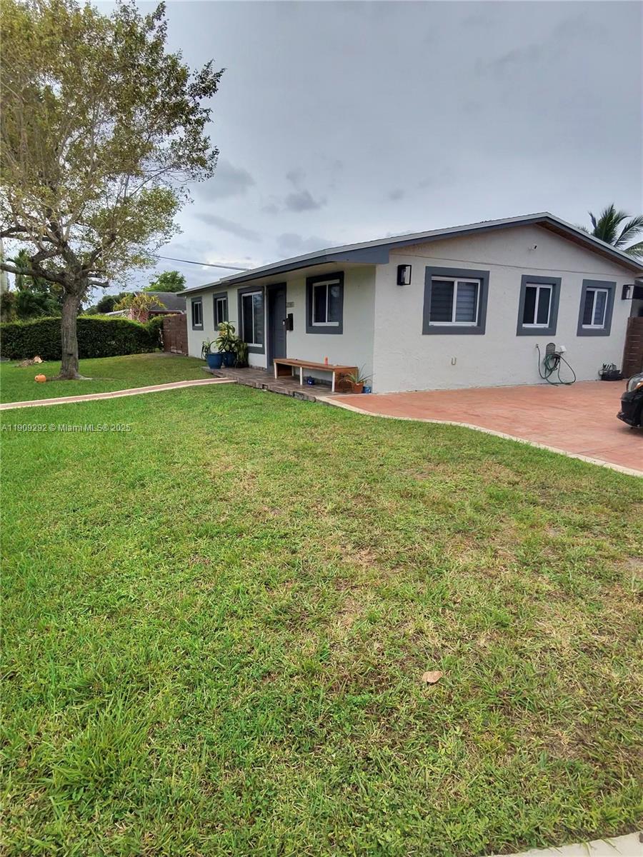 20180 Northwest 14th Court Miami Gardens, FL 33169 - Photo 5 of 12 front view of a house with a yard