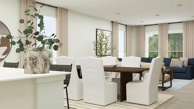 a view of a dining room with furniture and window