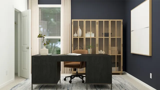 a view of a dining room with a table and chairs