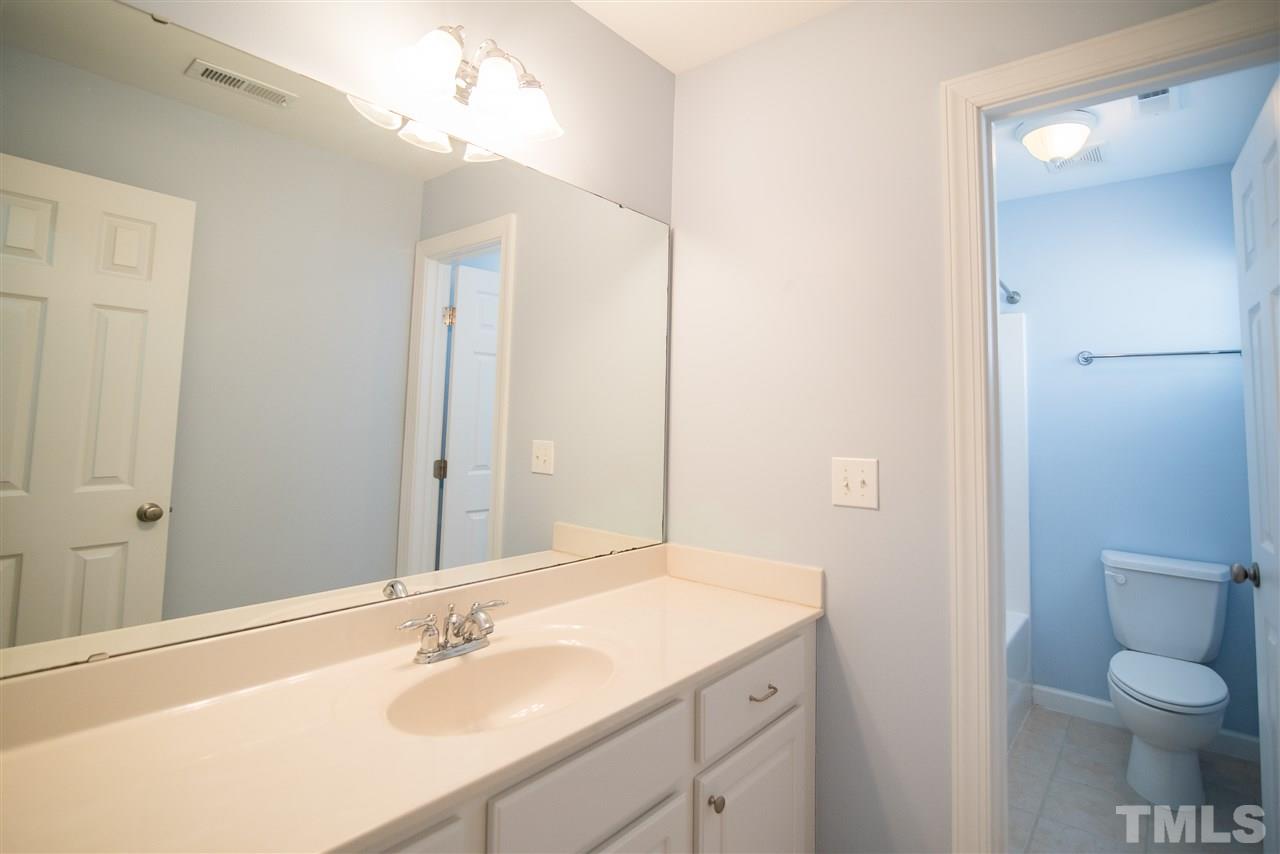 11006 Flower Bed Court Raleigh, NC 27614 - Photo 16 of 24 a bathroom with a sink a toilet and shower