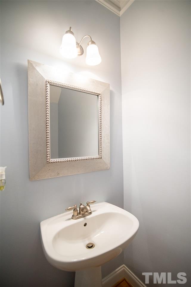 11006 Flower Bed Court Raleigh, NC 27614 - Photo 10 of 24 a bathroom with a sink and a mirror