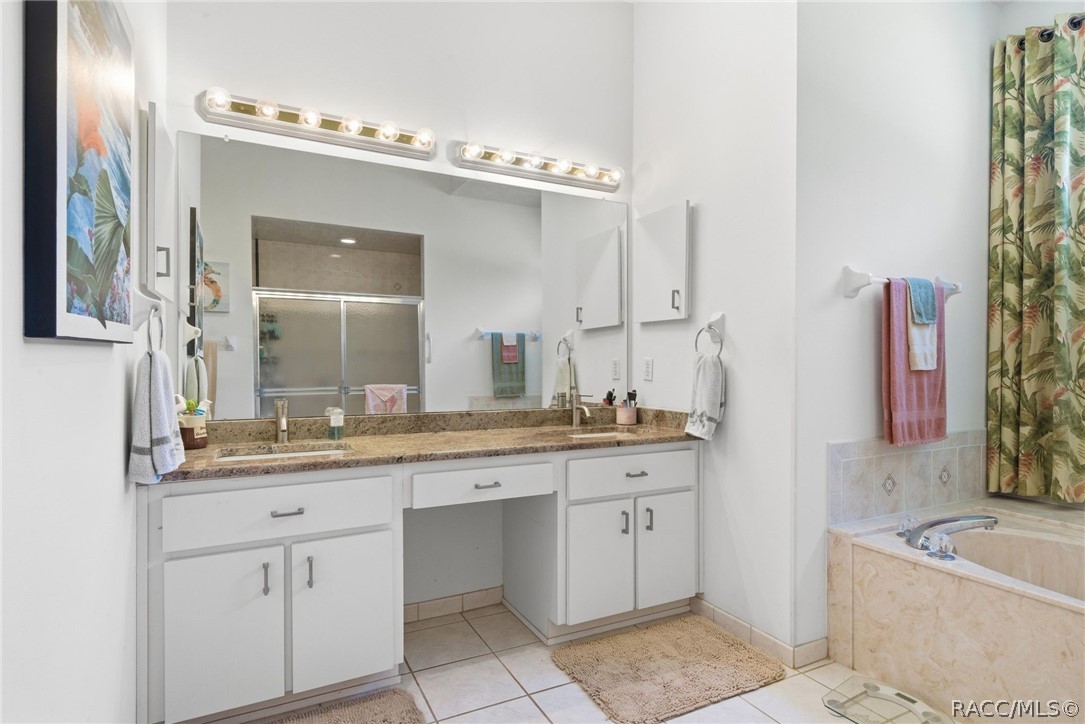 8204 East Fairway Loop Inverness, FL 34450 - Photo 35 of 71 Double sink across from large walk-in shower