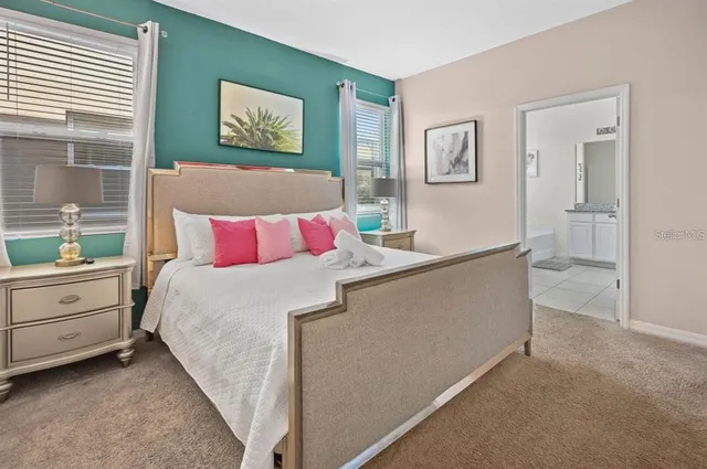 a bedroom with bed and window