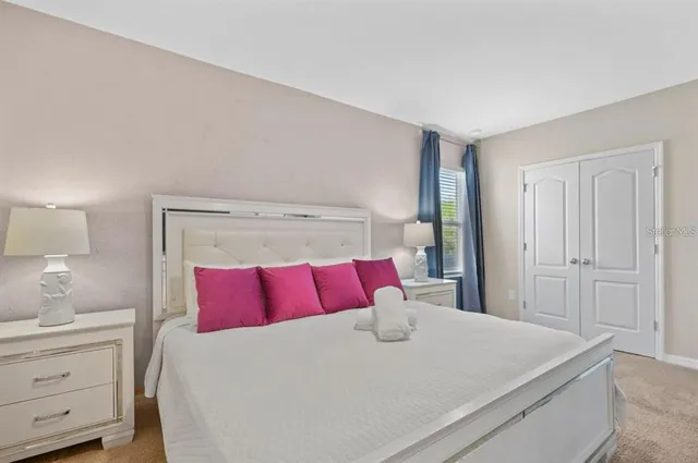 a bedroom with a bed and a couch