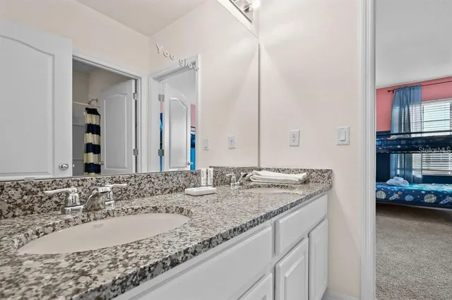 a bathroom with a toilet and a shower curtain