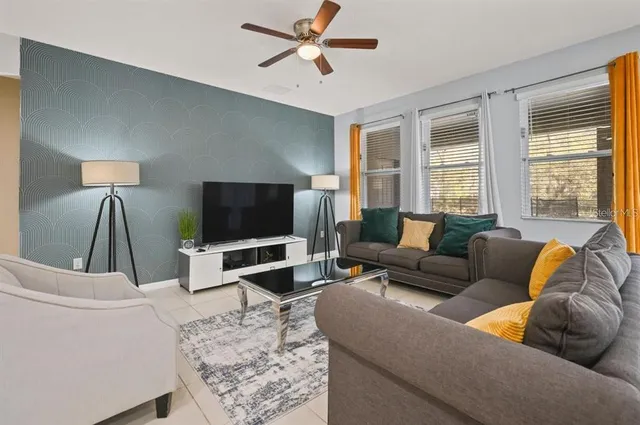 a living room with furniture and a flat screen tv