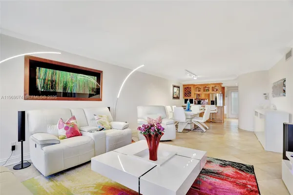 a living room with furniture or couch and a potted plant