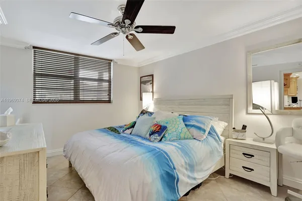a bedroom with bed and a window