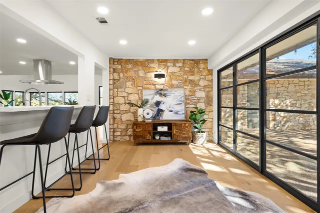 a living room with furniture and a large window