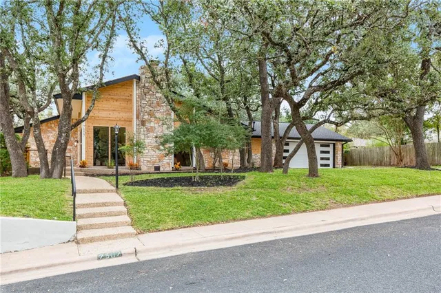 a view of an empty room with a balcony and balcony