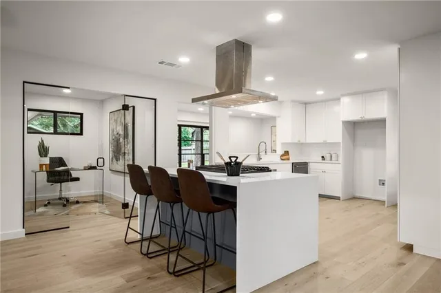 a view of kitchen with cabinets and stainless steel appliances